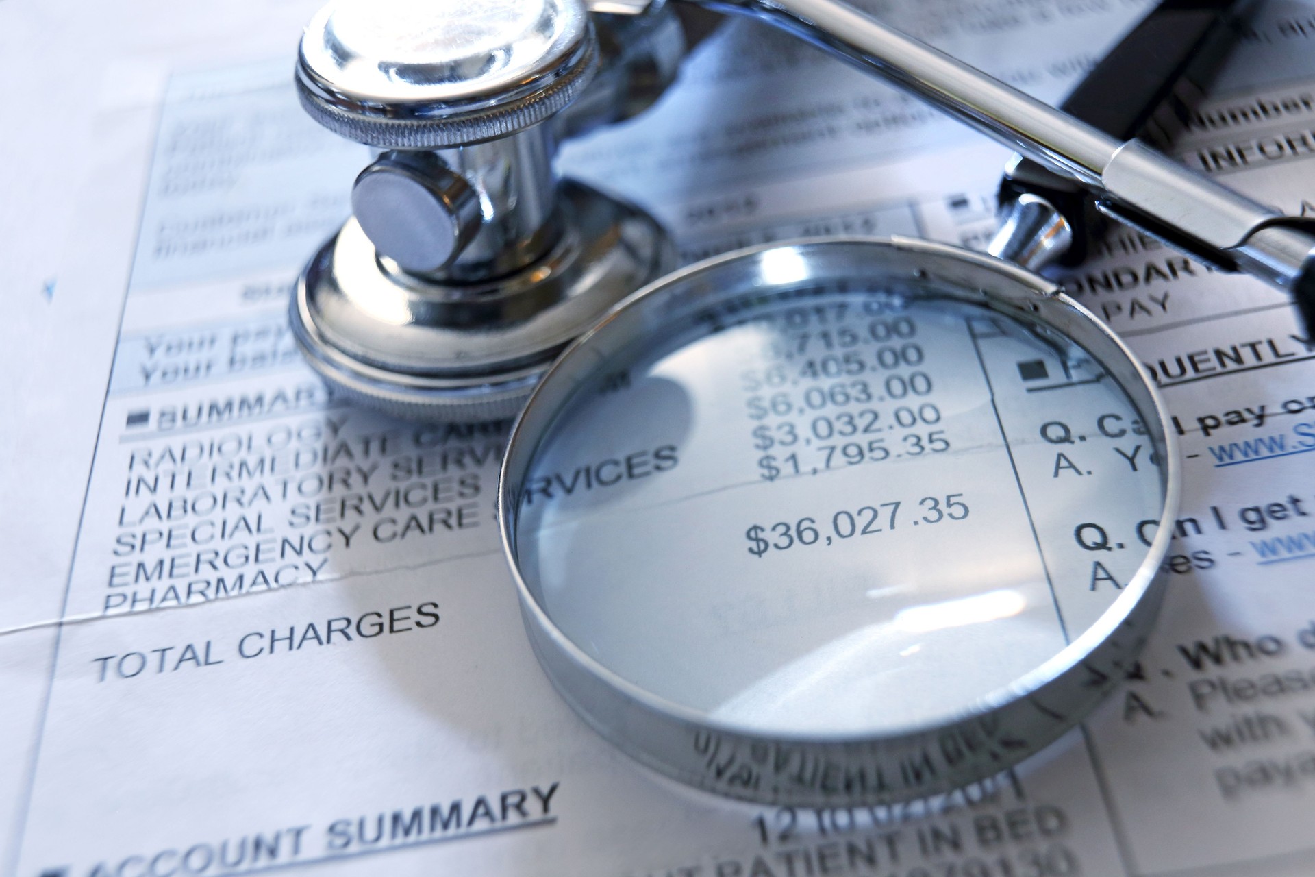 Magnifying Glass And Stethoscope On A Medical Invoice